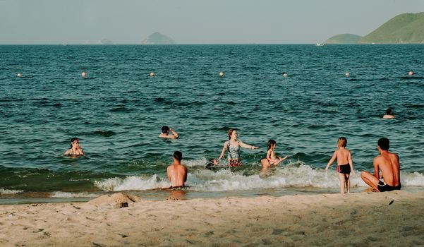 children playing beach sand busan summer family travel