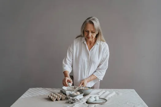 elderly woman cooking eggs kitchen healthy meal