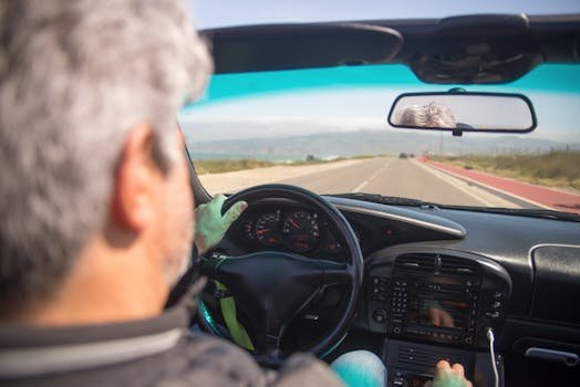 happy person driving new car highway sunny day