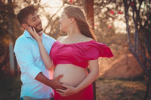 happy pregnant woman touching belly smiling sunshine outdoor