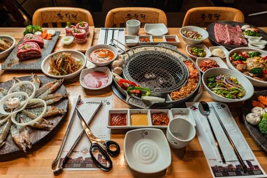 korean restaurant interior wooden table seafood meal setting