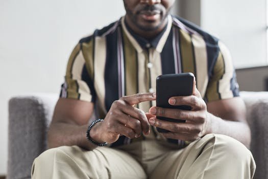 person using smartphone applying online event application form