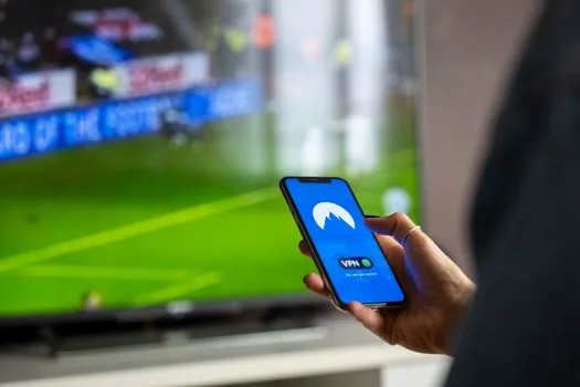 person watching sports on smartphone mobile streaming