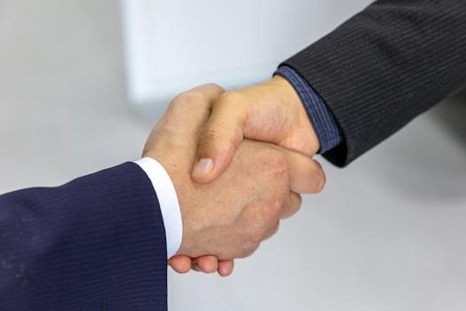 business cooperation partnership handshake technology deal future