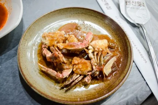soy marinated crab korean food rice bowl chopsticks close up