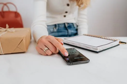 Korean smartphone showing subscription cancellation checklist and card payment notification on kitchen table, realistic editorial photo, no readable logo text