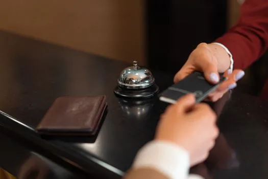 smartphone fraud warning with credit card on desk