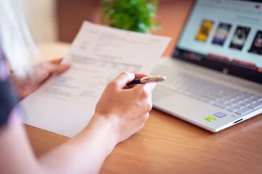 insurance claim documents, hospital receipt, pen and smartphone on clean desk, Korean healthcare paperwork, realistic photo, no readable text