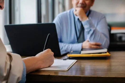 Korean applicant preparing employment documents with laptop certificate page, printer, ID card, and checklist on clean desk | 취업 서류와 4대보험 가입내역 확인서를 함께 준비하는 장면