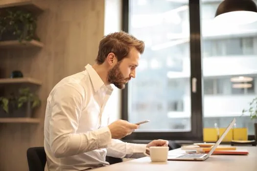 Korean laptop user reviewing scheduled email list beside wall calendar and phone reminder, realistic bright office desk, no readable private email | Gmail 예약함에서 발송 전 메일을 확인하는 장면