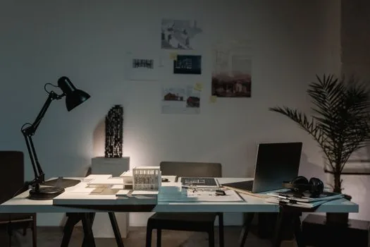 Korean user comparing apartment floor plan and building register on laptop, no readable personal information, bright real estate consultation desk