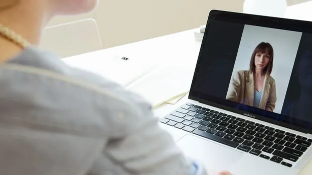 remote worker manually entering meeting ID and passcode in video meeting app on laptop, smartphone with invitation email nearby, realistic clean desk | 회의 ID와 암호를 직접 입력하는 장면