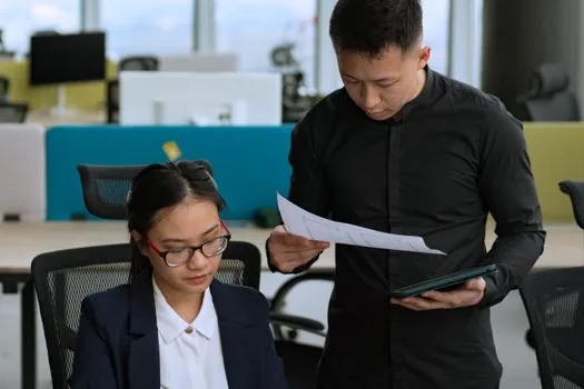 Seoul housing policy consultation desk with apartment documents, resident checking SH notice on tablet, realistic public service scene | 장기전세 계약서와 SH 안내를 상담창구에서 확인하는 장면