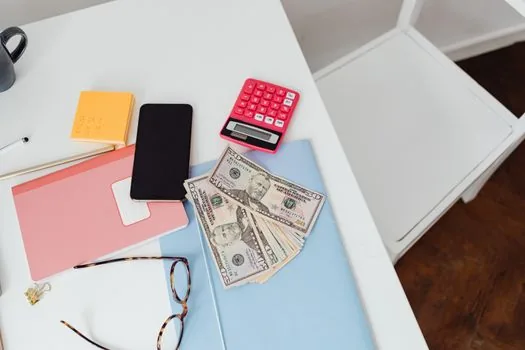 smartphone and telecom bill statement on desk with refund checklist