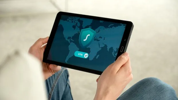 Windows security firewall allowed apps screen on desktop monitor, Korean user checking app permission with smartphone nearby, realistic home office | Windows 방화벽에서 카카오톡 앱 허용 상태를 확인하는 장면