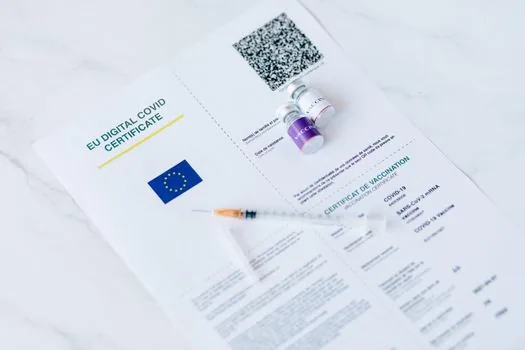 Korean caregiver preparing family relationship certificate, proxy form and ID copies beside national health insurance branch visit memo, realistic document scene | 가족 계좌 신청에 필요한 위임장과 가족관계증명서를 준비하는 장면