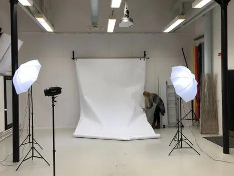 Korean person preparing ID photo file on laptop with plain white background photo preview, no readable personal data, realistic photo | 주민등록증 재발급용 사진 파일 규격을 확인하는 장면