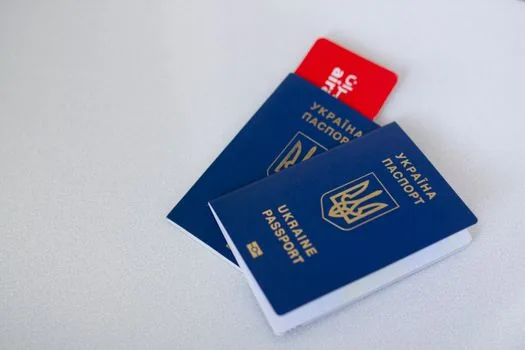 overseas rental car counter with passport, Korean license, international driving permit and booking voucher on desk, realistic travel photo