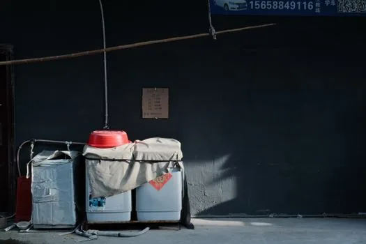 refrigerator and washing machine marked for free e-waste pickup reservation, apartment entrance, realistic daylight | 폐가전 무상방문수거와 대형폐기물을 구분하는 장면