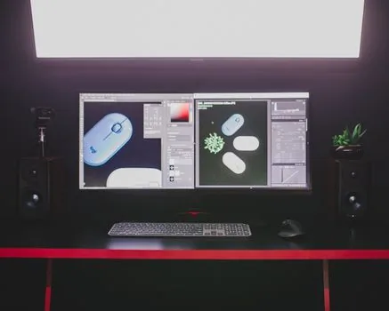 dual monitor Windows 11 workstation with two different scale settings being compared, bright realistic editorial desk photo, no logos