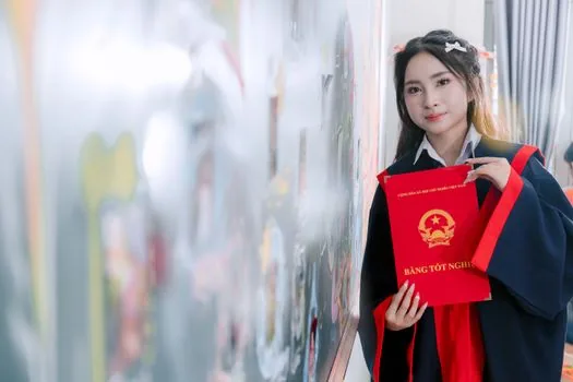 graduation school name search results on laptop with old school yearbook and notepad, Korean administrative document mood, clear practical scene