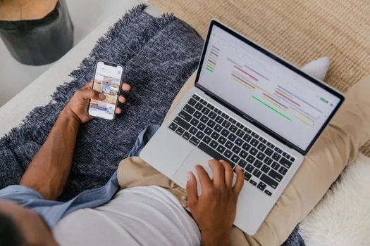 laptop and smartphone showing privacy checklist and calendar retention periods for government notifications, realistic Korean home office, no readable personal data