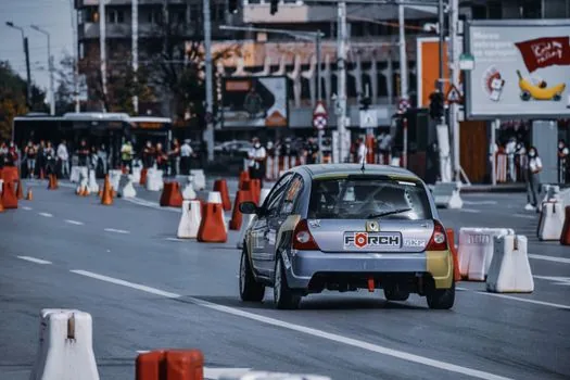 realistic Korean city tunnel traffic scene with one lane partially blocked by cones and cars slowing down, safety-focused news photo style