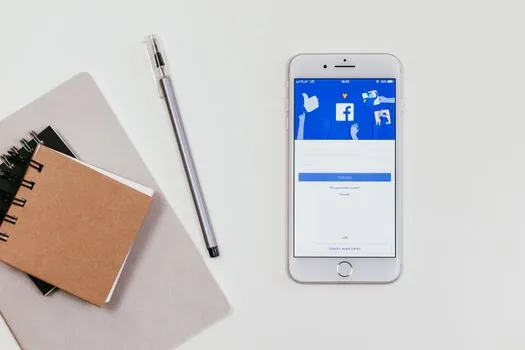 smartphone scanning QR code from laptop Telegram Desktop login screen, Korean home desk, realistic security login scene