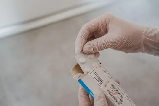 Korean adult checking health insurance app and refund note after smoking cessation treatment visits, pharmacy receipt and calendar visible, realistic editorial photo | 금연치료 이수 인센티브 환급 여부를 확인하는 장면