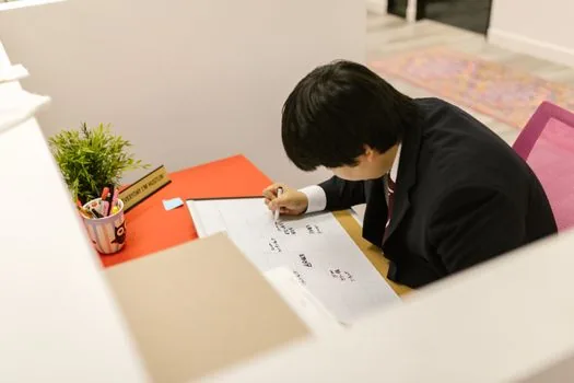 Korean adult reviewing counseling voucher appointment card and calendar at a calm public health center desk, realistic editorial photo, no text | 심리상담 바우처 신청 전 상담 일정과 서류를 확인하는 장면