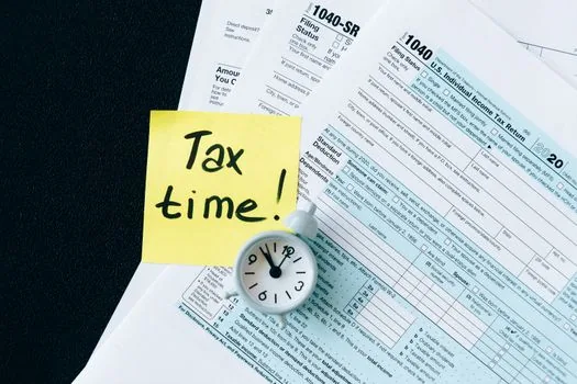 Korean property tax bill beside calendar marked September 16 to 30, apartment owner checking notice, realistic editorial image