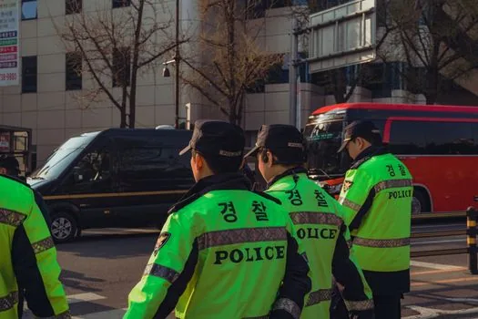 Korean traffic civil service office desk with driver's license and consultation about license penalty points, realistic editorial photo no text