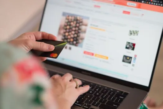 person entering electronic payment number on Wetax style tax payment page, clean home office, realistic editorial image