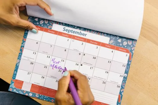 person filling smoking cessation management card with calendar, nicotine patch and health checklist on clean desk, realistic photo | 금연클리닉 관리카드에 흡연량과 상담 일정을 적는 장면